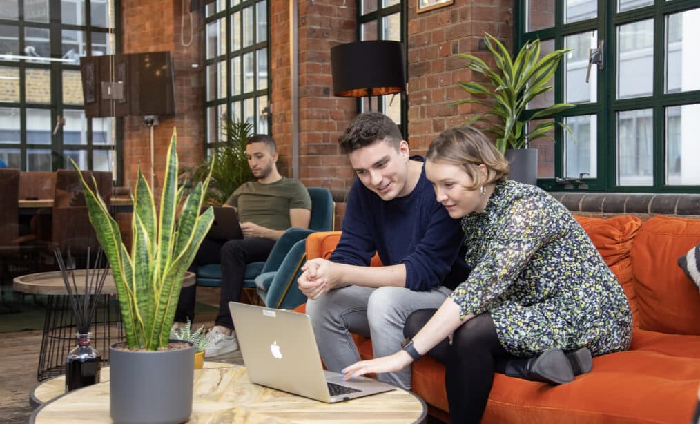 Students in University working together on a laptop