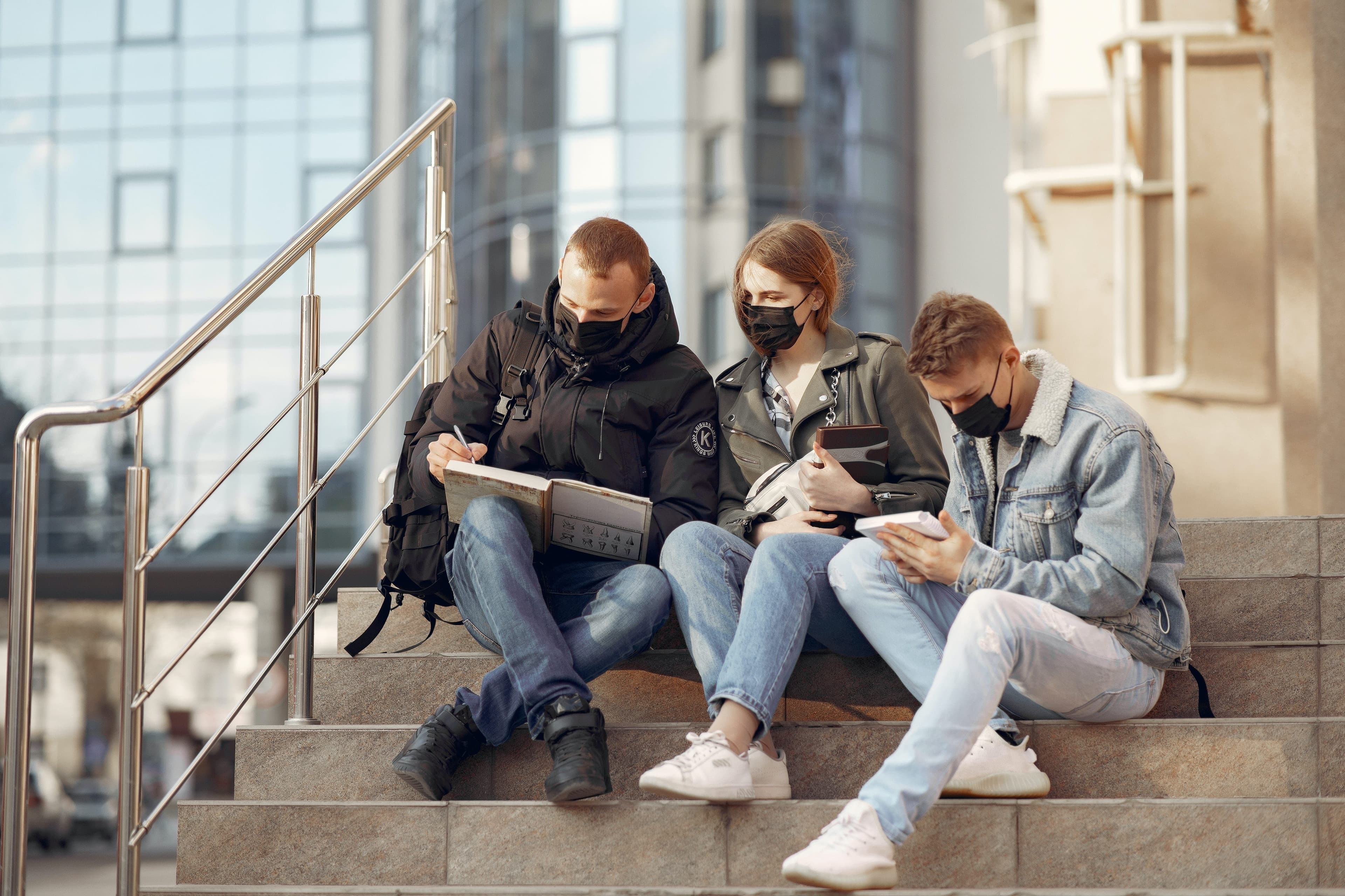 students sitting on University stairs
