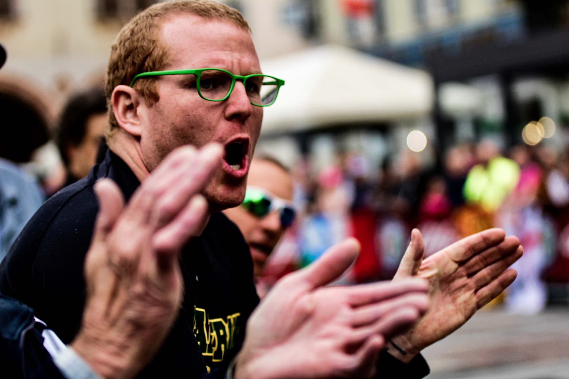 man cheering and clapping