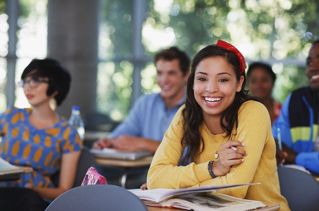 college-students smiling in classroom