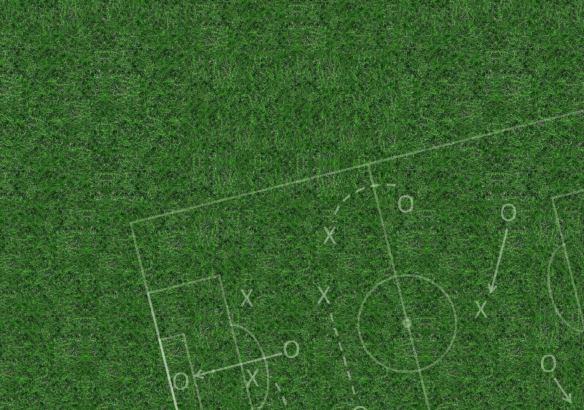 field with whiteboard soccer play overlayed