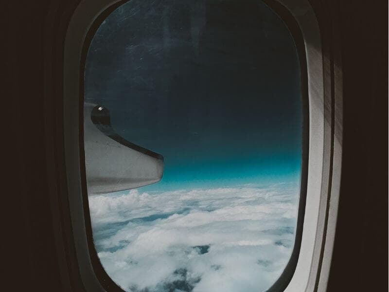 view of cloudy sky out of airplane window